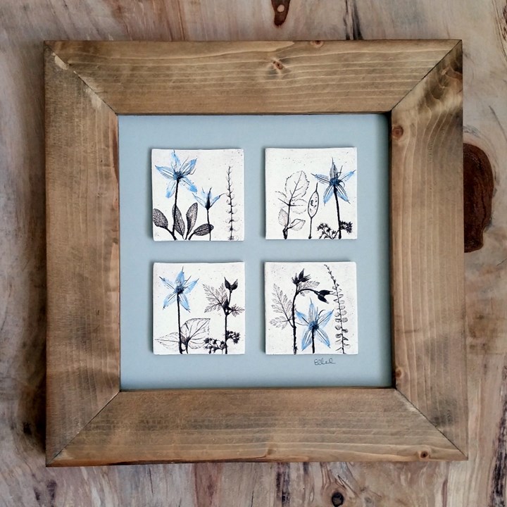 Four Framed Tiles With Blue Hues
